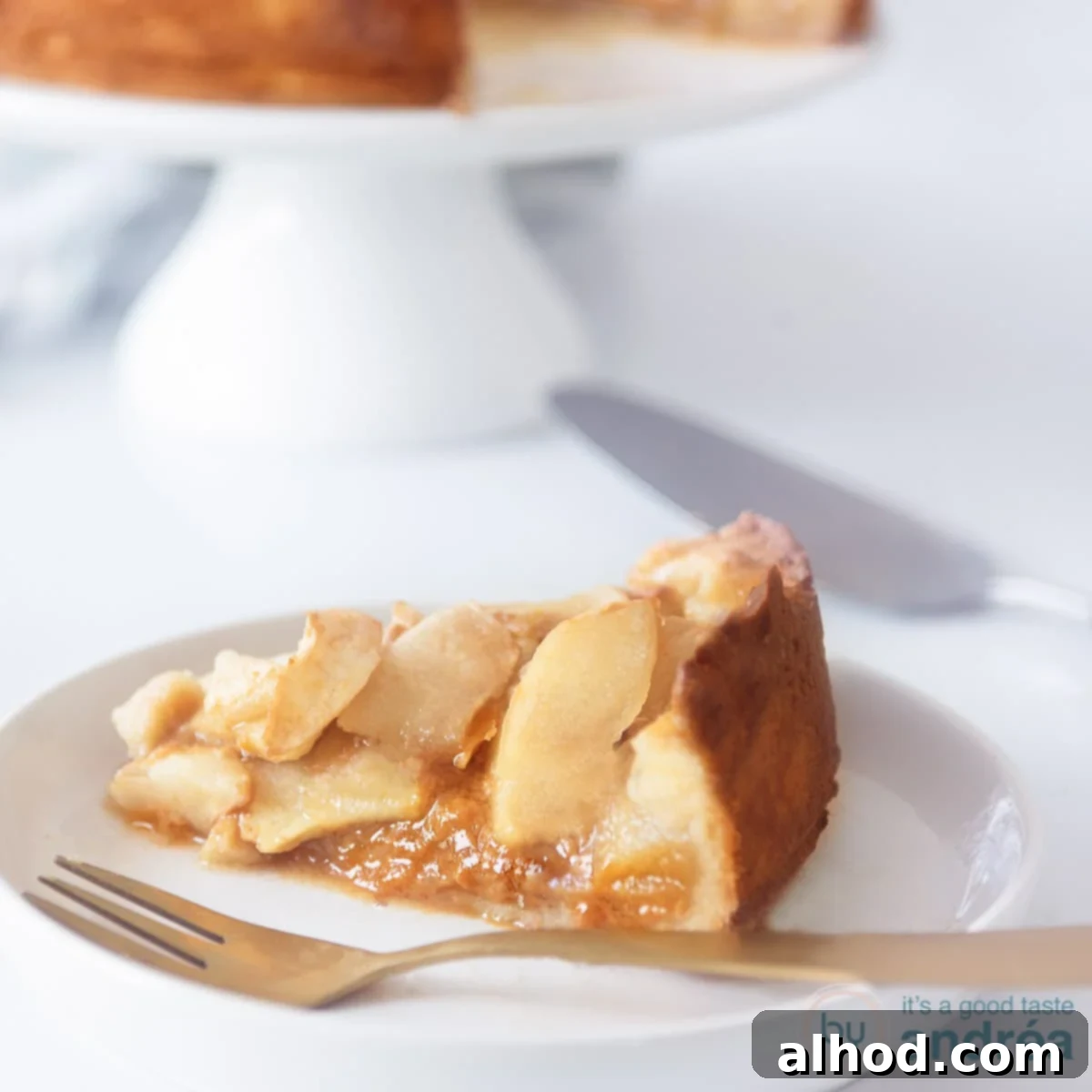 Golden Toffee Apple Pie 4 A delicious apple pie on a white plate with a tea towel. A square photo
