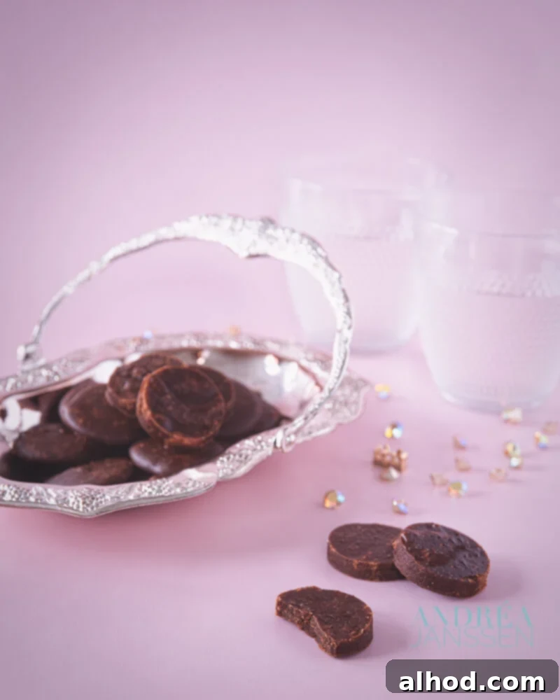 Molten Chocolate Lava Cake 3 A silver platter with chocolate fondant. Some fondants in the front and all in a pink background