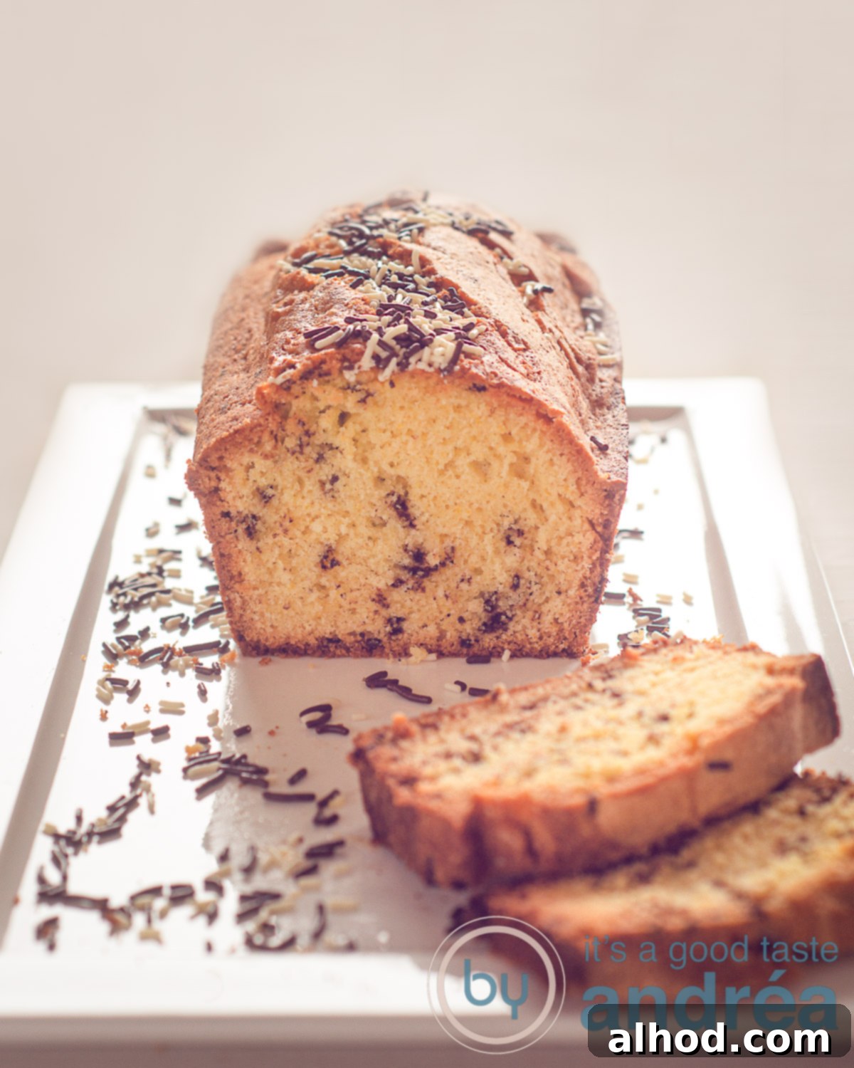 Dutch Hagelslag Vanilla Cake 5 a white plate with Chocolate sprinkles cake and sprinkles around