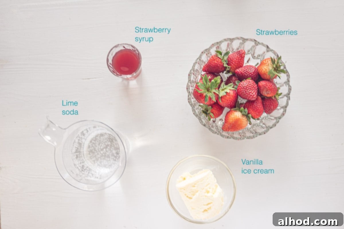 Strawberry Soda Float 3 Ingredients for Strawberry Ice Cream Soda on a white background with descriptive text labels for strawberries, syrup, soda, and ice cream.