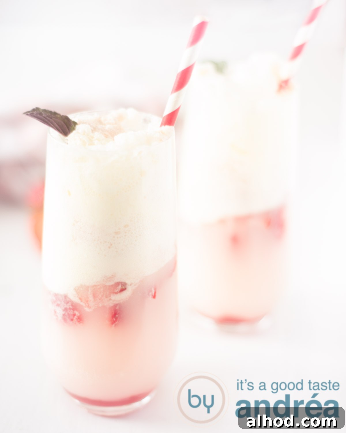 Strawberry Soda Float 5 Refreshing strawberry soda ice cream, garnished with mint and a straw, looking inviting for a summer day.