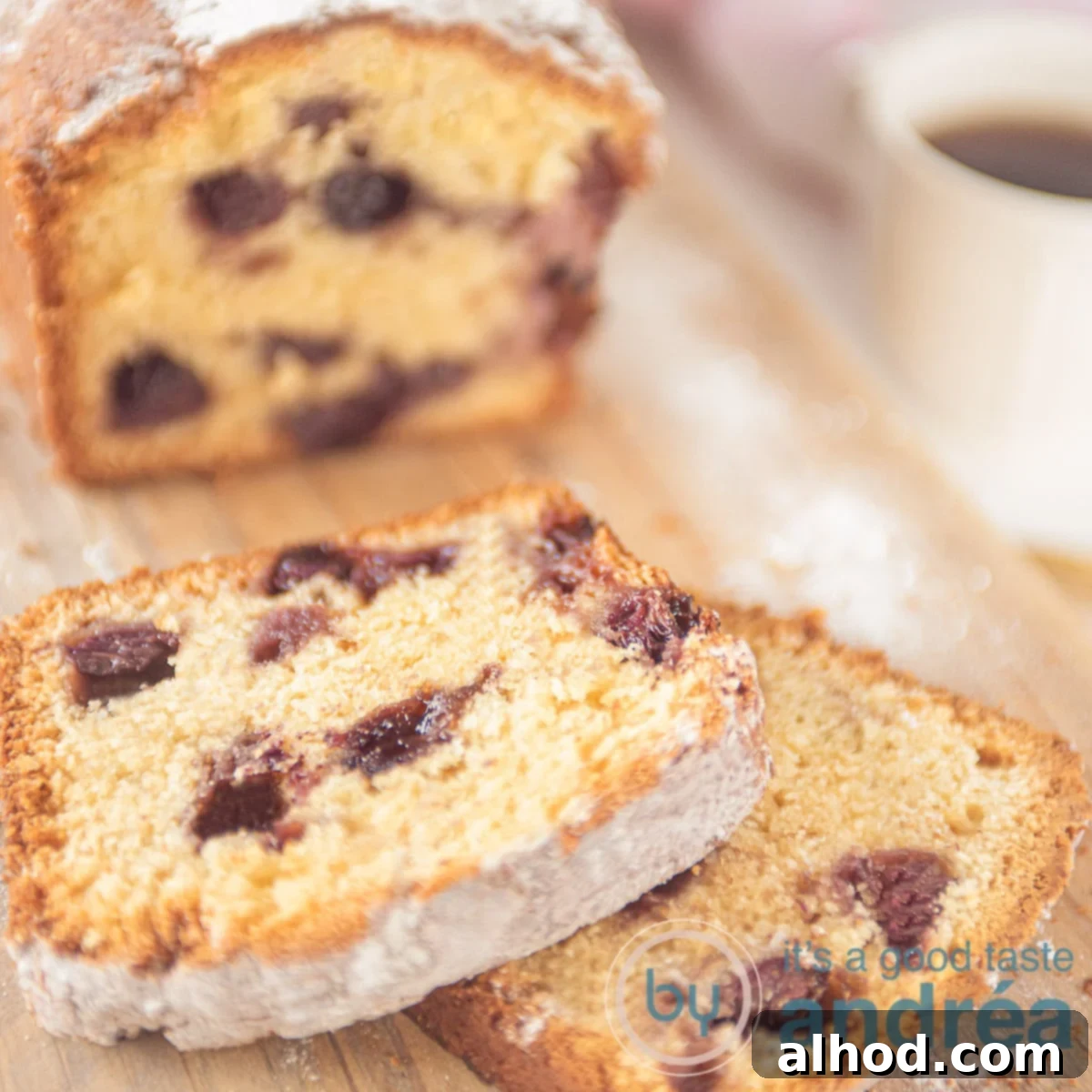 Tangy Blueberry Yogurt Cake 6 A square shot of a blueberry cake and a cup of coffee