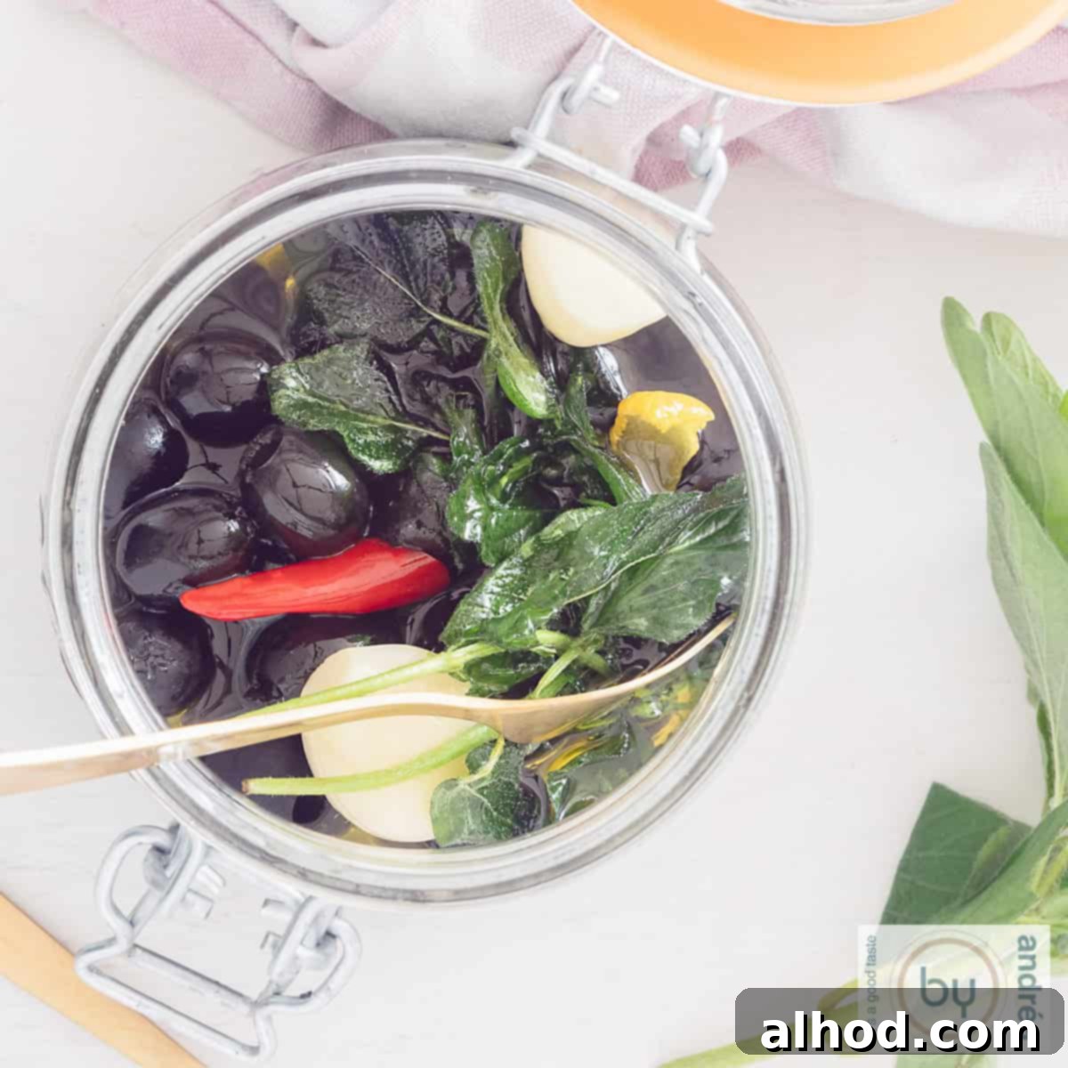 A preserving jar filled from above with Greek marinated olives