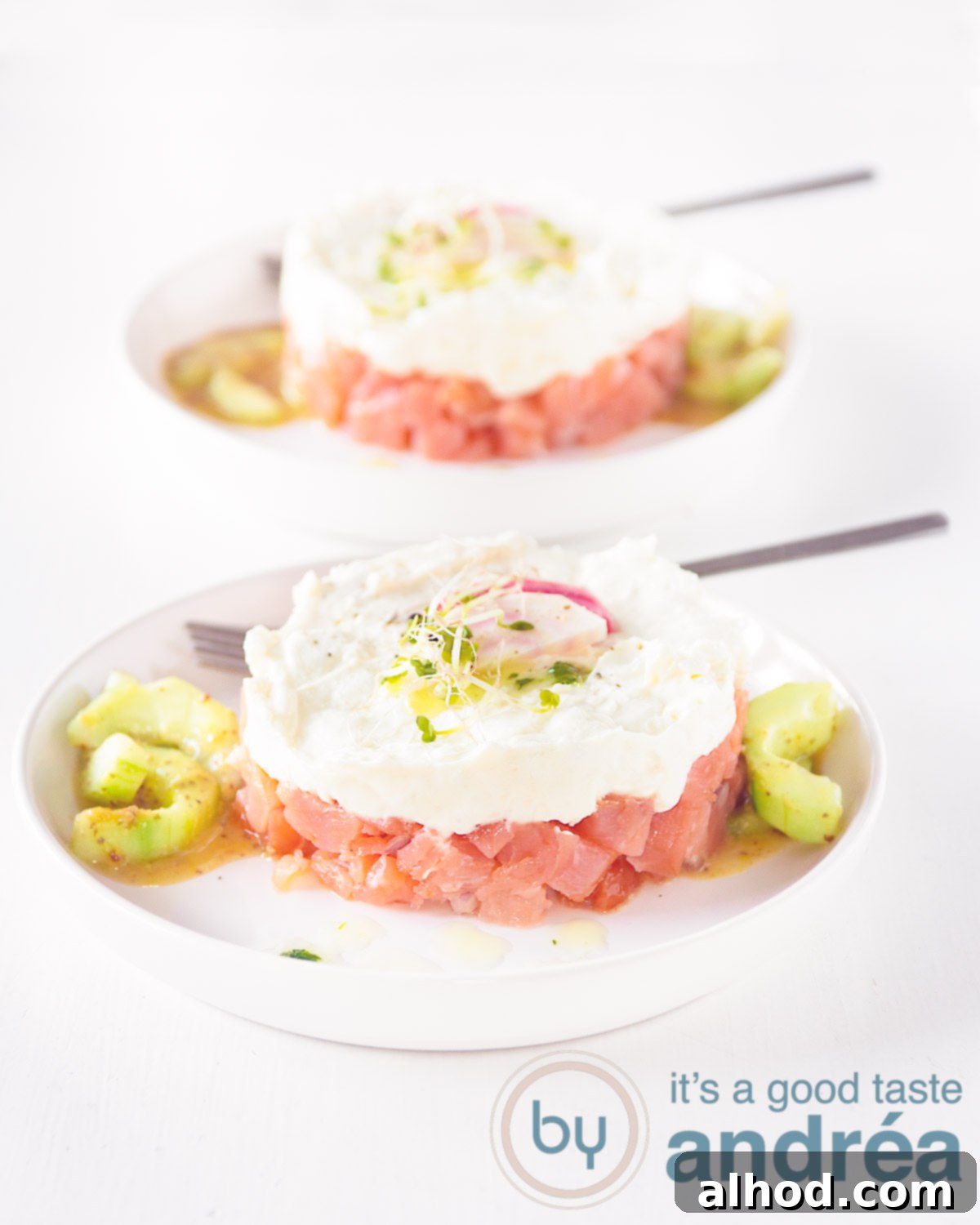 Elegant tower of smoked salmon and tangy goat cheese, with arugula dressing
