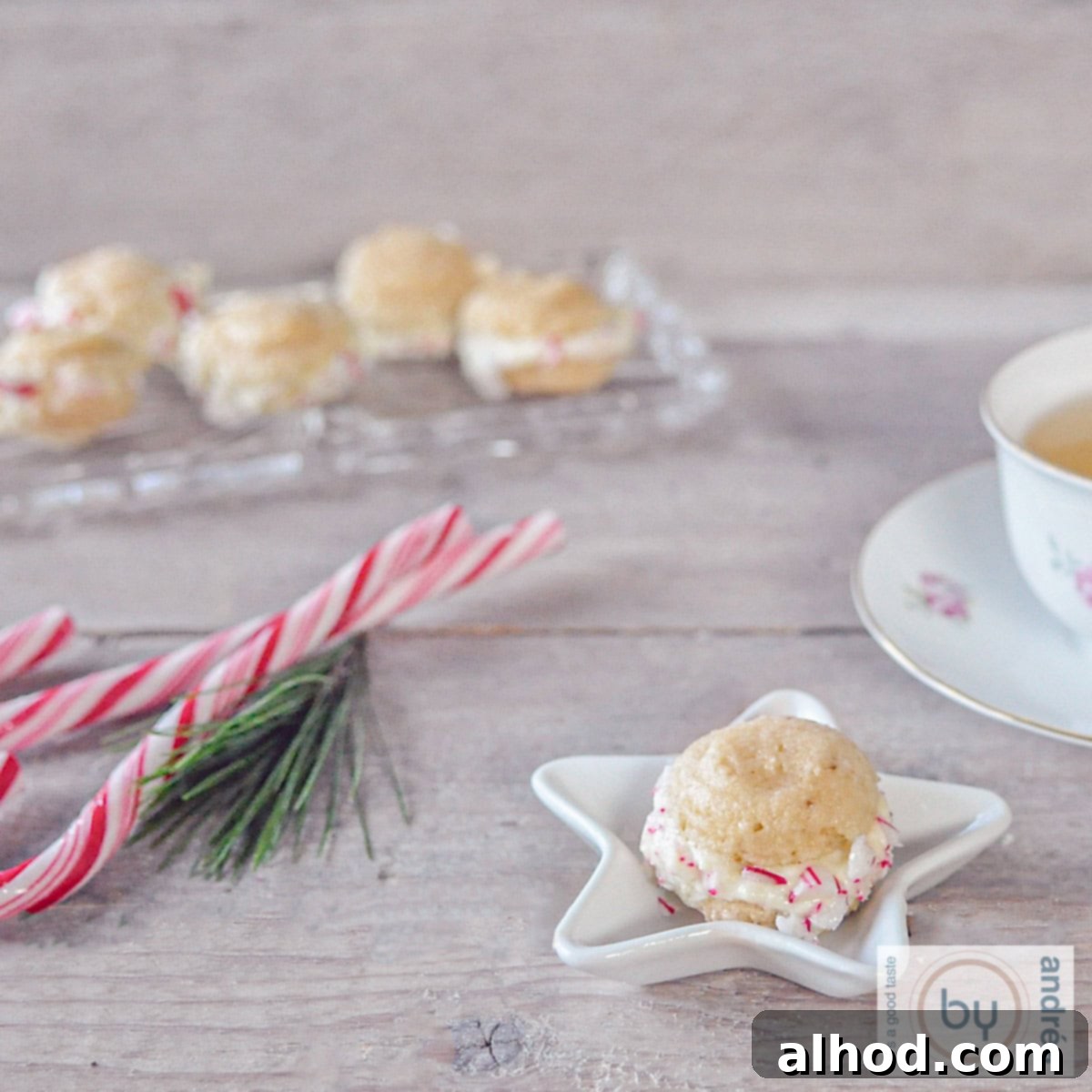 A festive white Christmas bowl elegantly filled with vibrant macarons. The scene is completed with charming candy canes and an additional glass bowl of macarons in the background, exuding holiday cheer.