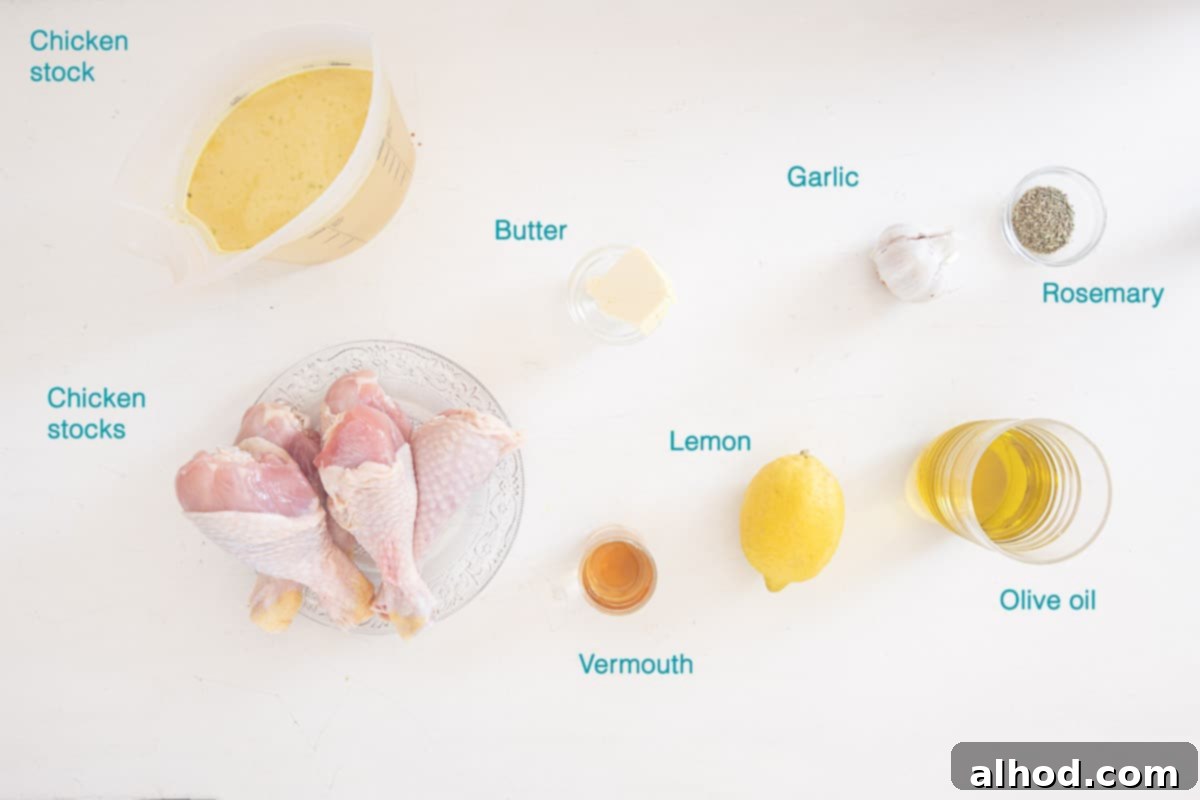 Individual ingredients for Dutch Oven Lemon Butter Chicken Drumsticks are neatly arranged on a white background, each labeled for clarity.