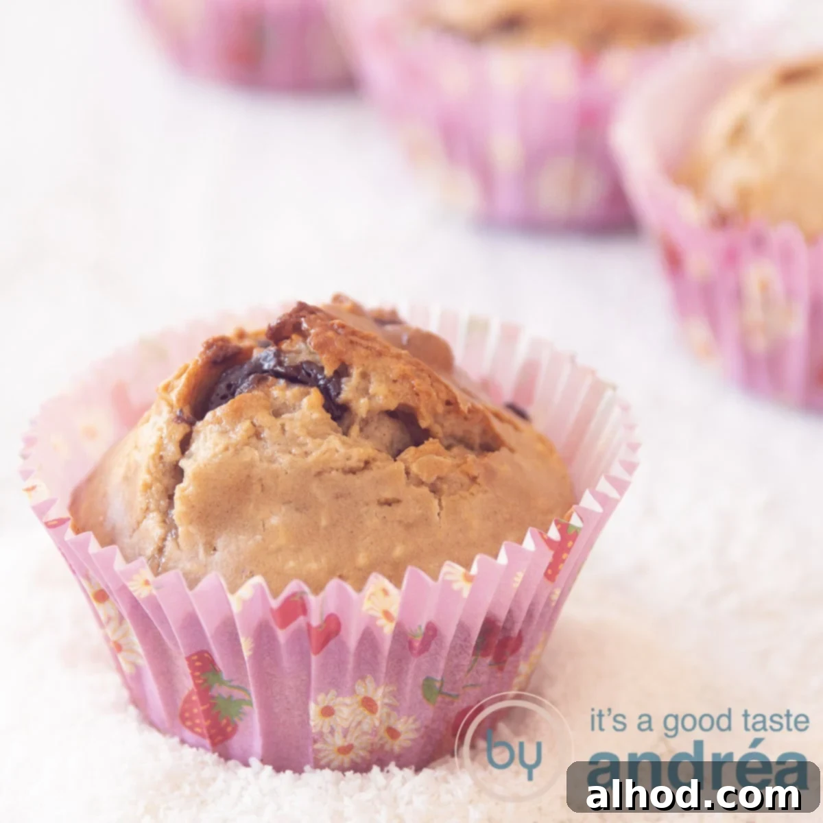 Irresistible Gluten-Free Chocolate Buckwheat Muffins 6 A square photo with in the foreground a muffin with chocolate and coconut, gluten-free and in the background three muffins (partly visible). The muffins are in grated coconut.