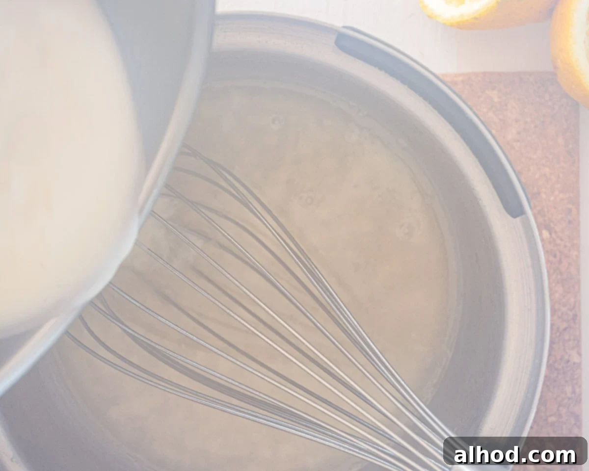 Silky Lemon Bliss in Three Ingredients 5 While stirring, add cream to the lemon mix in the saucepan.