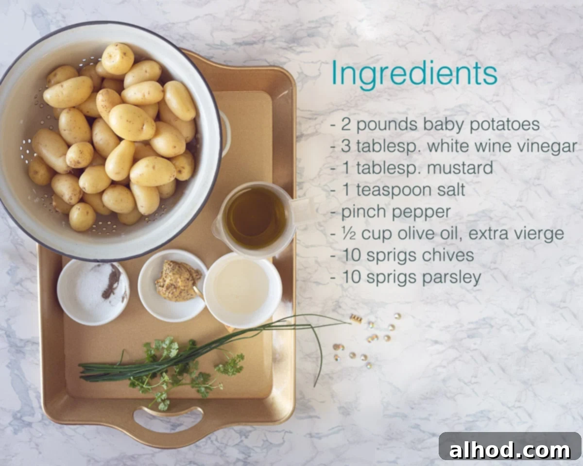 Velvety Baby Dutch Potato Salad 3 Ingredients baby potato salad on a golden tray. At the right a marble backdrop with a text description of all the ingredients.