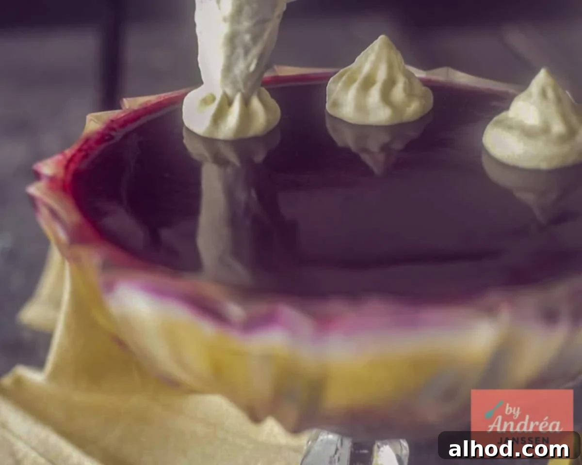 Using a whipped cream piping bag, pipe large rosettes of whipped cream onto the trifle