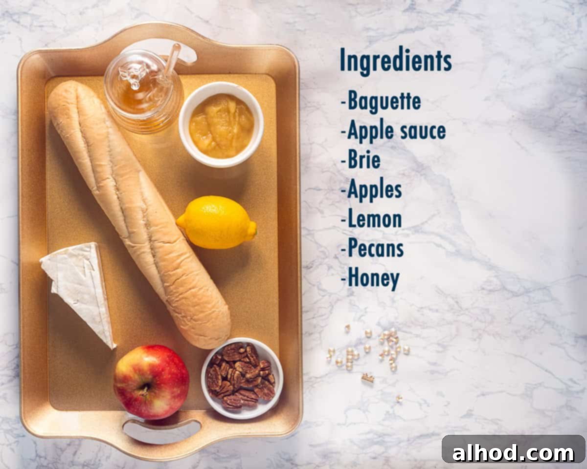 Ingredients Brie Apple Crostini With Honey And Pecans on a golden tray with on the right a text description