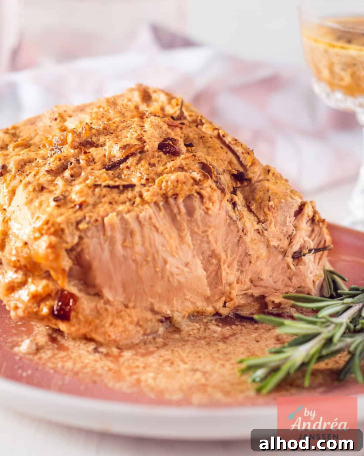 Close-up of juicy slow cooker pork rollade with mustard and garlic crust