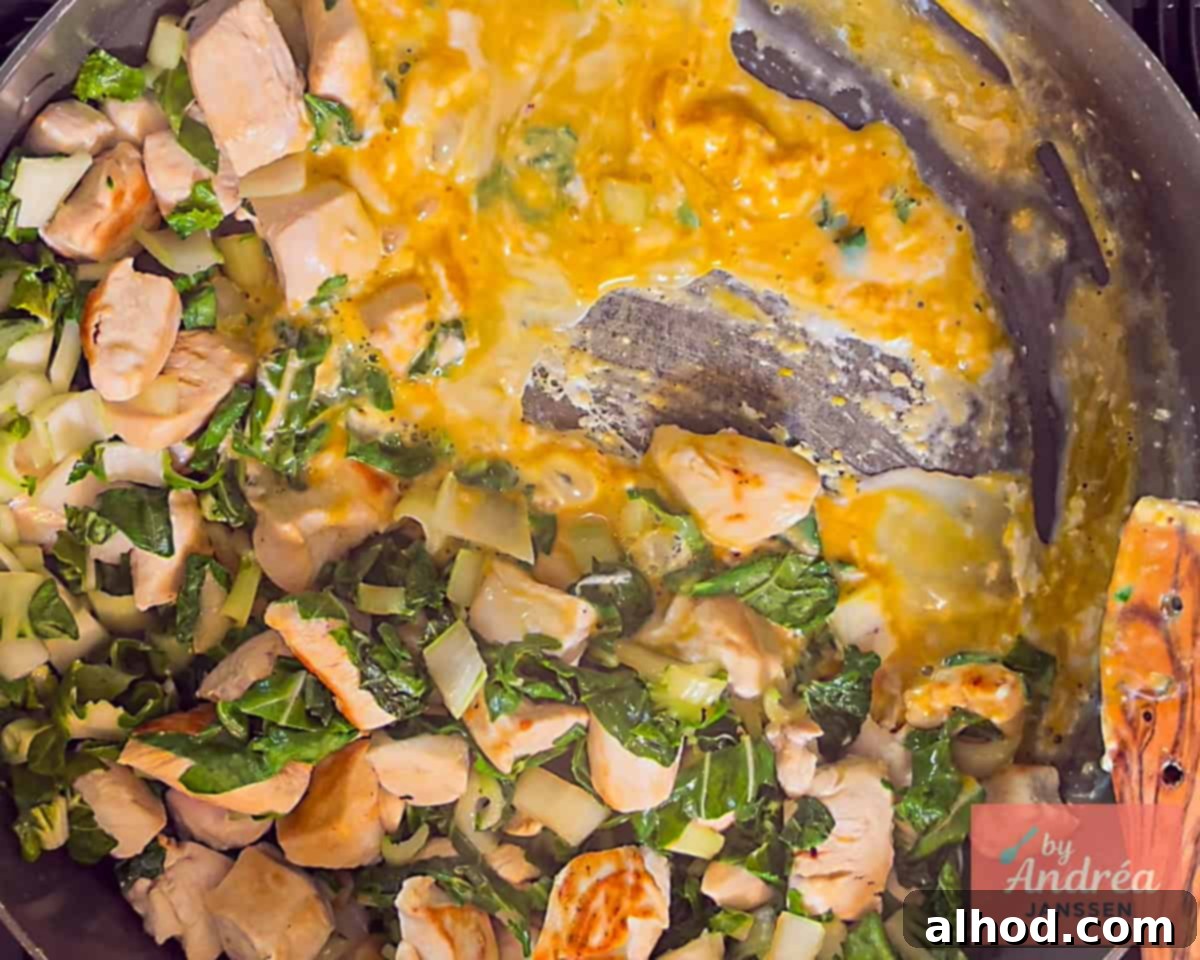 Quick Chicken Pad See Ew: 20-Minute Thai Noodle Perfection 6 Adding and scrambling the egg in the pan with chicken and bok choy for Chicken Pad See Ew