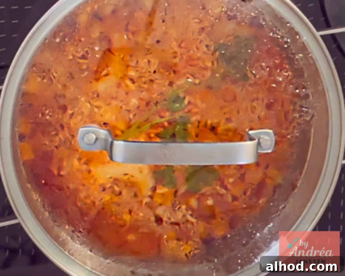 30-Minute Fiesta Rice 8 Rice is cooked with the lid on the pan.