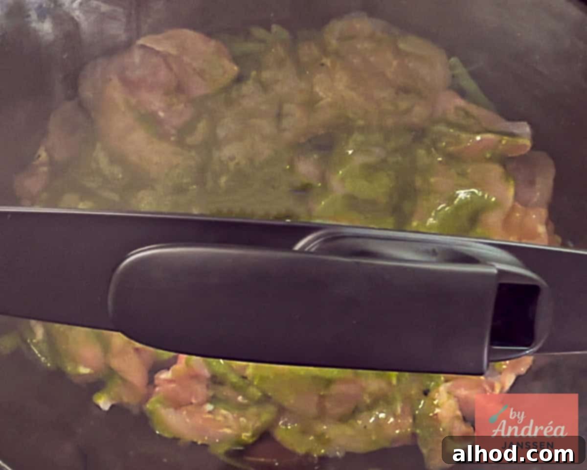 Slow Cooker Creamy Tuscan Pesto Chicken 6 Slow cooker with lid on, ready to cook the flavorful Tuscan chicken to perfection.