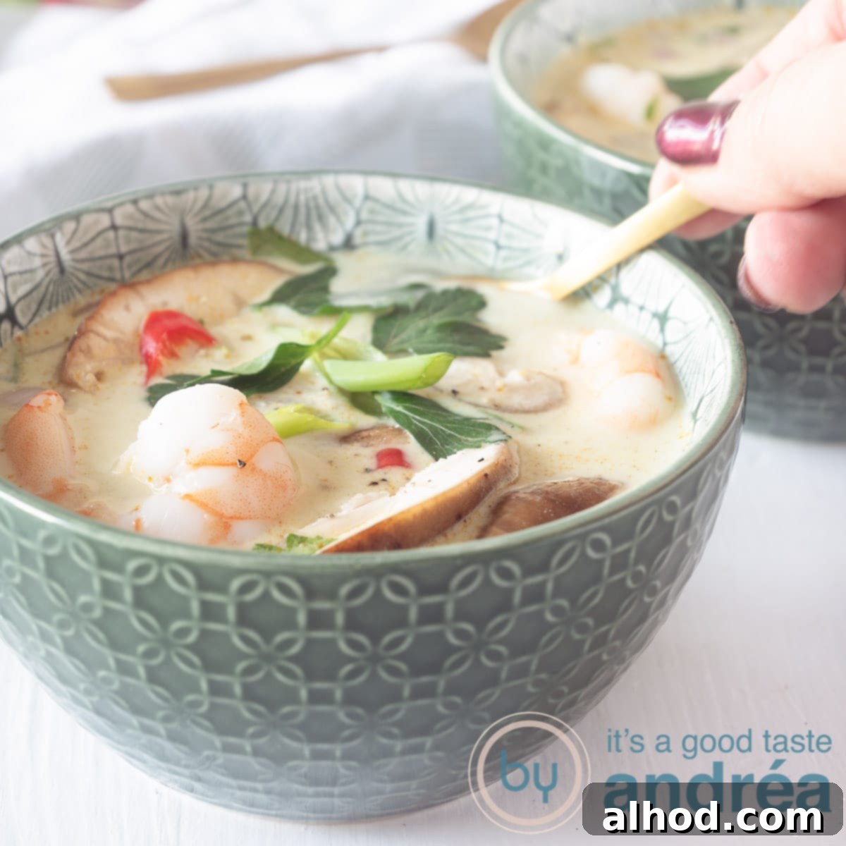 A bowl of flavorful Tom Kha Goong (Thai Coconut Soup with Shrimp), perfect for a comforting Thursday dinner.